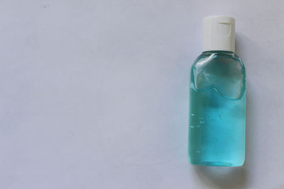 Close-up of bottle against white background