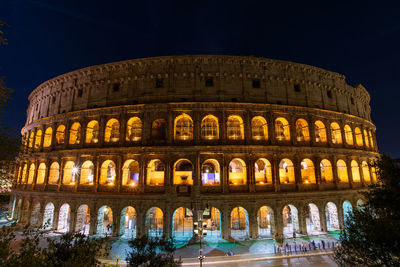 Low angle view of illuminated historical building against sky at night