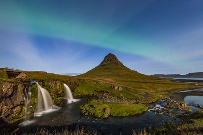 Scenic view of mountain against sky at night