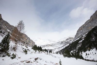 Scenic view of snow covered mountains against sky