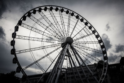 Low angle view of ferris wheel against sky