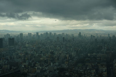 High angle view of modern buildings in city against sky