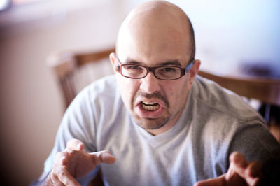 Portrait of man wearing eyeglasses