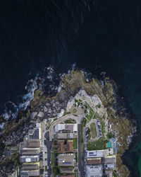Aerial view of buildings by sea