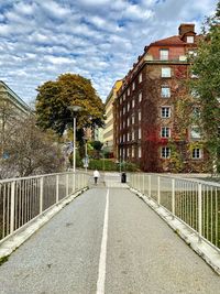 Street amidst buildings against sky