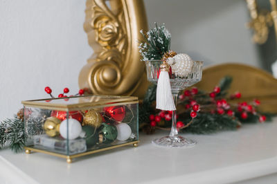 Christmas table decor, glass box with balls and a glass