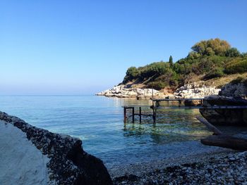 View of calm blue sea against clear sky