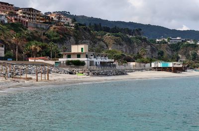 View of swimming pool by buildings in city