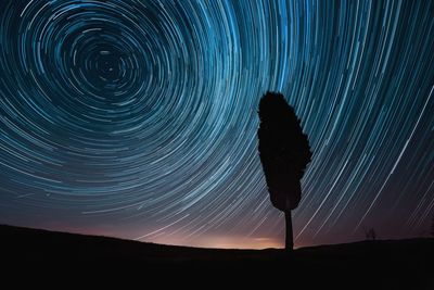 Startrail in tuscan hills. tuscany, italy