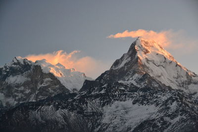 Scenic view of snowcapped mountains against sky during winter