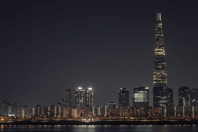 Illuminated buildings in city at night