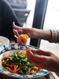 Midsection of person preparing food on table