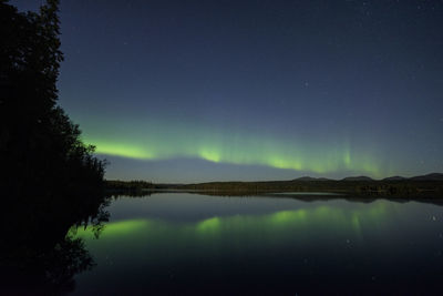 Scenic view of lake against star field at night