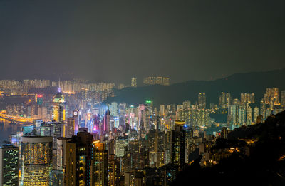 Aerial view of city lit up at night