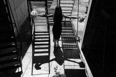 High angle view of people walking on staircase