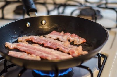 Close-up of meat in cooking pan