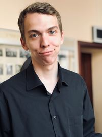 Portrait of young man standing outdoors