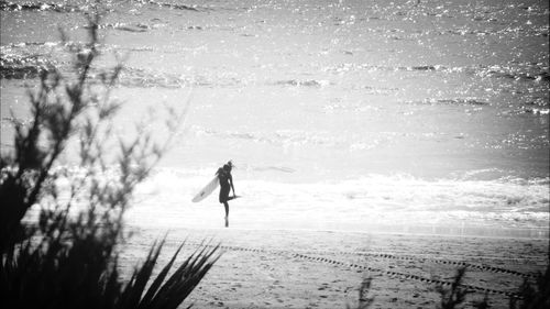Full length of woman standing in water