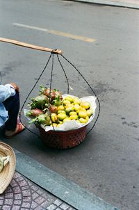 High angle view of man eating food on street