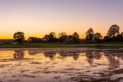 Scenic view of field against sky during sunset