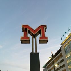Low angle view of statue against sky in city