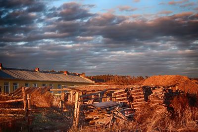 Houses on field against sky