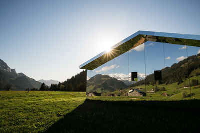 Scenic view of field against clear sky