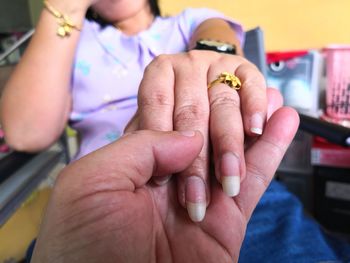 Close-up of woman holding hands