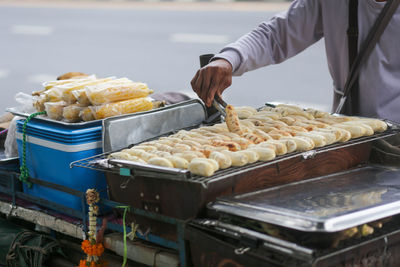 Grilled bananas are sold and prepared on the streets