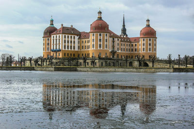 View of historical castle with lake