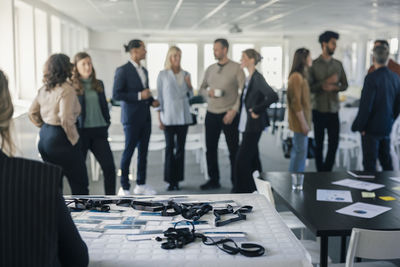 Group of business people talking during conference break