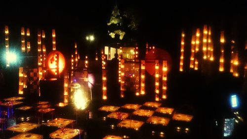 Reflection of illuminated lights in puddle