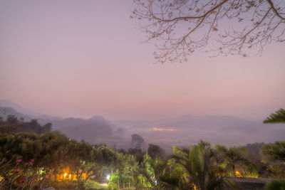 Scenic view of mountains against sky at dusk