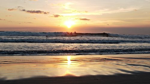 Scenic view of sea at sunset