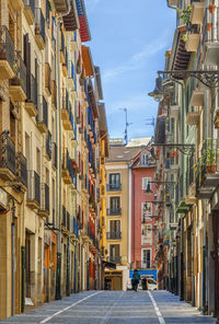 Alley amidst buildings in city