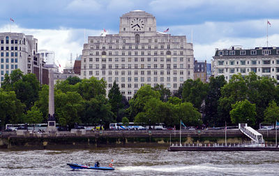 Buildings by river