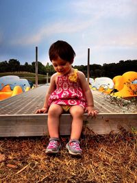 Girl playing on slide at playground