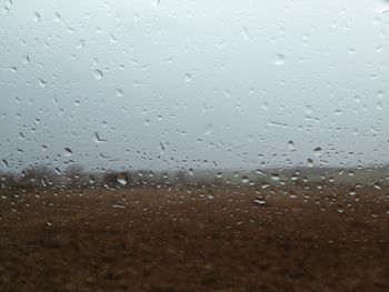 Full frame shot of raindrops on glass window