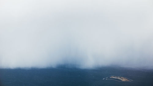 Scenic view of fog against sky