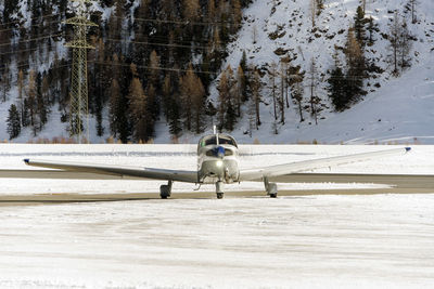A private jet landing in the engadine airport in st moritz in winter