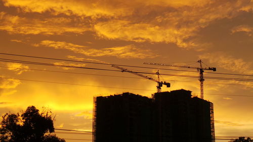 Low angle view of electricity pylon against sky