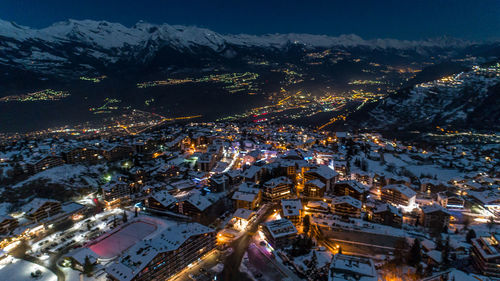 High angle view of illuminated cityscape during winter