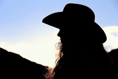 Close-up of silhouette person against sky during sunset