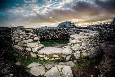 View of old ruin building against cloudy sky