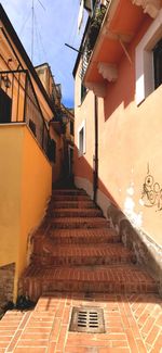 Staircase amidst buildings in city