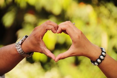 Heart shaped with couples' palms