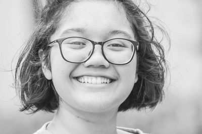 Close-up portrait of a smiling young woman