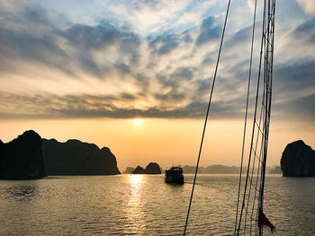 Scenic view of bay against sky during sunset
