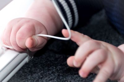 Close-up of hand holding hands