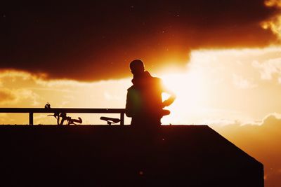 Silhouette of people at sunset